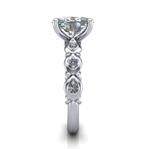 Nyla oval solitaire engagement ring in Platinum, side profile showing the vintage station band in side view