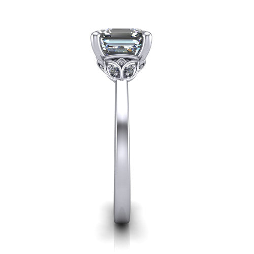Lola square emerald solitaire engagement ring in 18K White Gold, side profile showing the petal basket and polished band