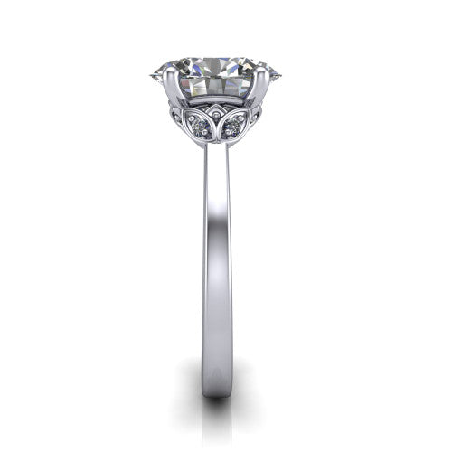 Lola oval solitaire engagement ring in 18K White Gold, side profile showing the petal basket and polished band