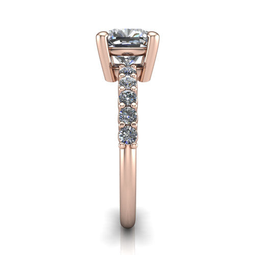 Fernanda cushion solitaire engagement ring in 18K Rose Gold, side profile showing the 4-prong head and shared-prong pave band