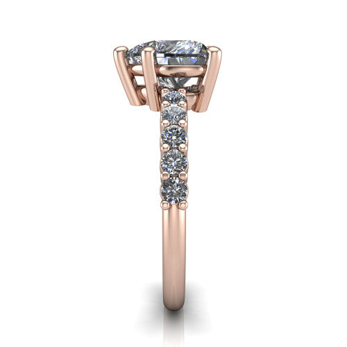 Fernanda heart solitaire engagement ring in 14K Rose Gold, side profile showing the 4-prong head and shared-prong pave band
