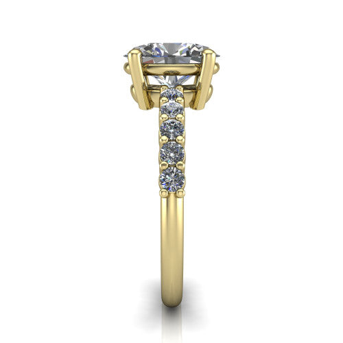Fernanda oval solitaire engagement ring in 18K Yellow Gold, side profile showing the 4-prong head and shared-prong pave band