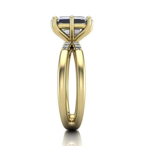 Raven emerald solitaire engagement ring in 14K Yellow Gold, side profile showing the accent diamonds along the dual band