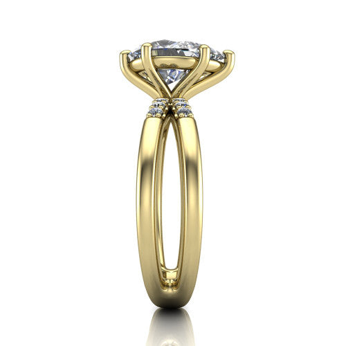 Raven pear solitaire engagement ring in 18K Yellow Gold, side profile showing the accent diamonds along the dual band