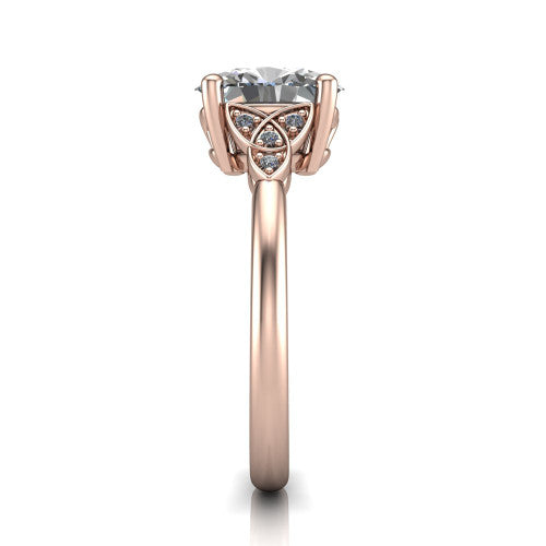 Lilith oval solitaire engagement ring in 18K Rose Gold, side profile showing the Celtic trinity knot accent and polished band