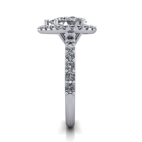 Mabel pear halo engagement ring in Platinum, side profile showing the pave band and open basket