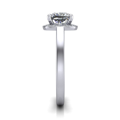 Coralie cushion-cut halo engagement ring in Platinum, side profile showing the pavé halo, filigree gallery, and polished band