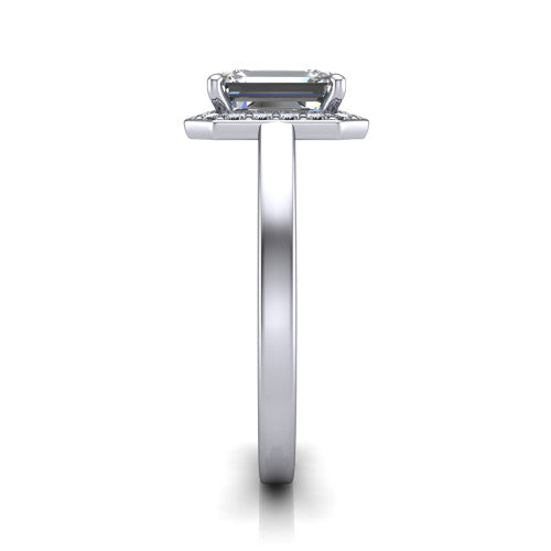 Coralie emerald-cut halo engagement ring in 18K White Gold, side profile showing the pavé halo, filigree gallery, and polished band