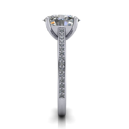Nicole oval solitaire engagement ring in Platinum, side profile showing the vintage scrollwork engraving on the band