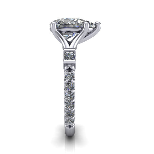 Arabella pear solitaire engagement ring in Platinum, side profile showing the bezel-set square accents and pave band