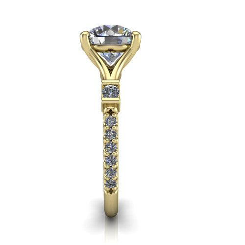 Arabella round solitaire engagement ring in 18K Yellow Gold, side profile showing the bezel-set square accents and pave band