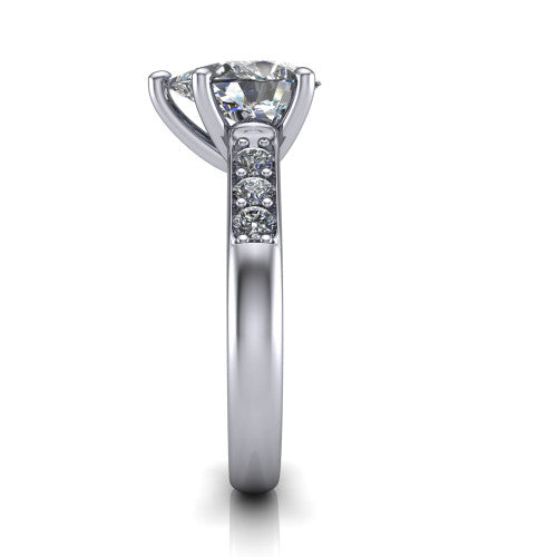 Nena pear solitaire engagement ring in 18K White Gold, side profile showing the channel-set shoulder diamonds