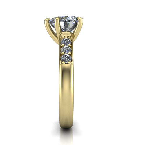 Nena heart solitaire engagement ring in 18K Yellow Gold, side profile showing the channel-set shoulder diamonds