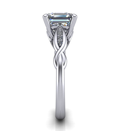 Lennon square emerald solitaire engagement ring in Platinum, side profile showing the twisted infinity band with accent diamonds