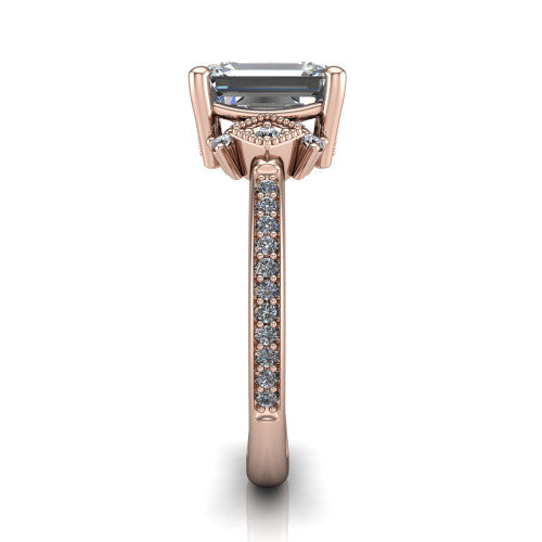 Presley emerald-cut three stone engagement ring in 18K Rose Gold, side profile showing the diamond side clusters and pavé band