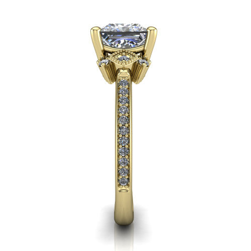 Presley princess-cut three stone engagement ring in 14K Yellow Gold, side profile showing the diamond side clusters and pavé band