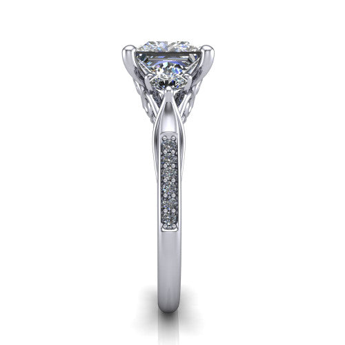 Celine princess three stone engagement ring in Platinum, side profile showing the filigree gallery and pave diamond band along the shoulders