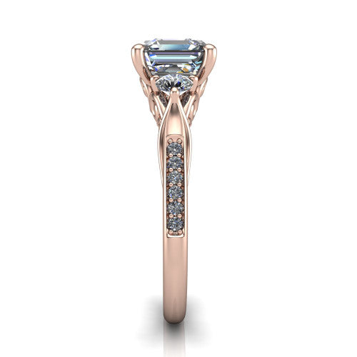 Celine square emerald three stone engagement ring in 14K Rose Gold, side profile showing the filigree gallery and pave diamond band along the shoulders