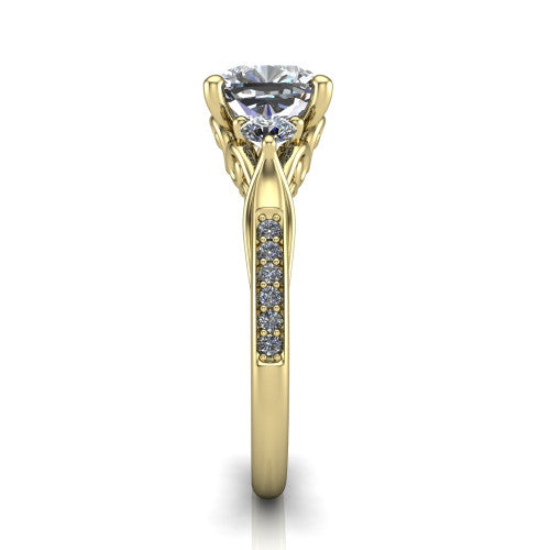 Celine cushion three stone engagement ring in 18K Yellow Gold, side profile showing the filigree gallery and pave diamond band along the shoulders