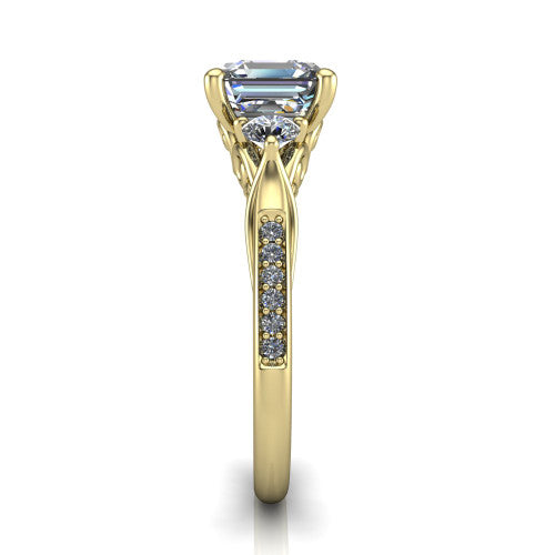 Celine square emerald three stone engagement ring in 18K Yellow Gold, side profile showing the filigree gallery and pave diamond band along the shoulders