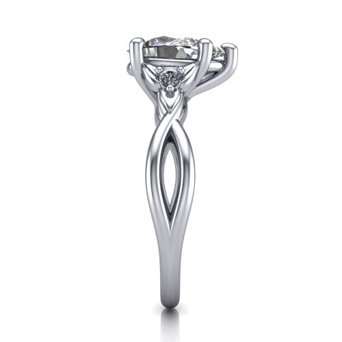 Catalina pear three stone engagement ring in Platinum, side profile showing the twisted infinity shank braiding beneath the head into a polished band