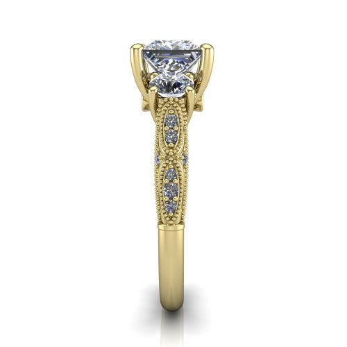 Rosemary princess three stone engagement ring in 18K Yellow Gold, side profile showing the milgrain pavé band and vintage shoulders in profile