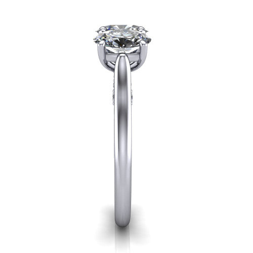Kora oval three-stone engagement ring in Platinum, side profile showing the pave-set band, scrollwork gallery, and high-polish profile