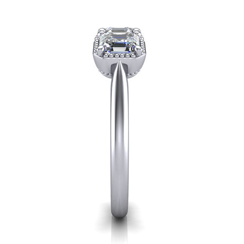 Evangeline square emerald-cut three-stone engagement ring in 14K White Gold, side profile showing the milgrain bezels and clean polished band in profile