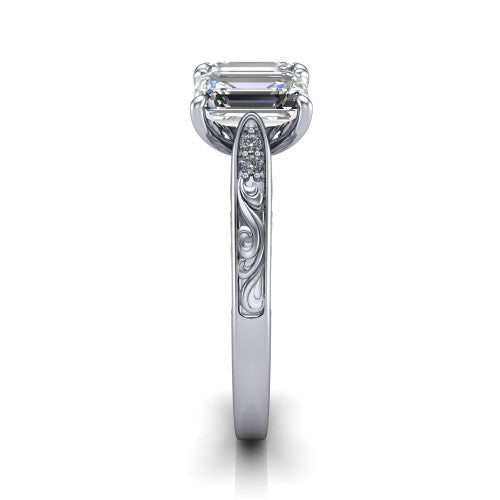 Navy emerald three stone engagement ring in Platinum, side profile showing the vintage engraved filigree band and the raised three-stone setting