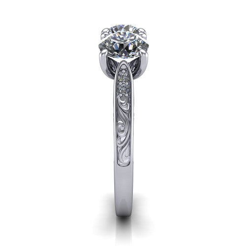 Navy round three stone engagement ring in 14K White Gold, side profile showing the vintage engraved filigree band and the raised three-stone setting