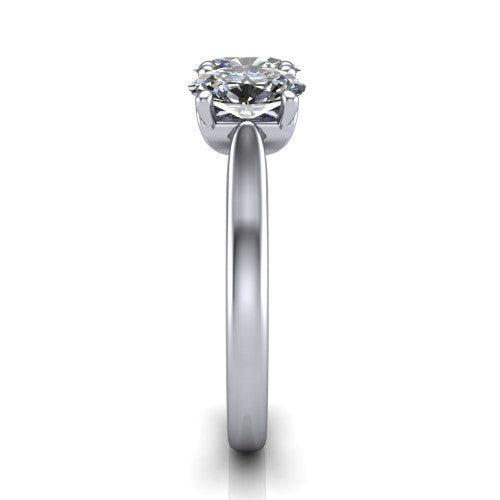 Amora oval three stone engagement ring in 18K White Gold, side profile showing the plain polished band and the raised three-stone setting