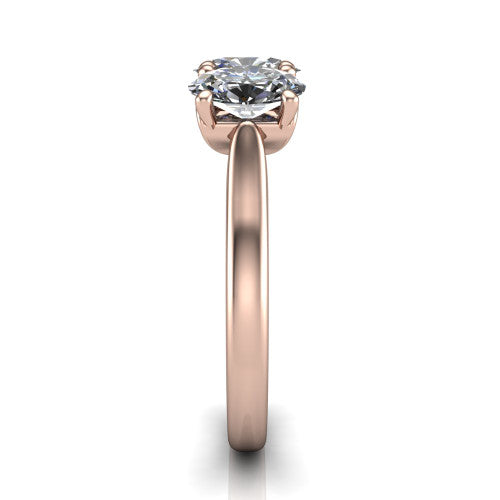 Amora oval three stone engagement ring in 18K Rose Gold, side profile showing the plain polished band and the raised three-stone setting
