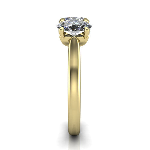 Amora oval three stone engagement ring in 14K Yellow Gold, side profile showing the plain polished band and the raised three-stone setting