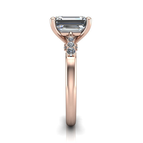 Jimena emerald solitaire engagement ring in 14K Rose Gold, side profile showing the pavé shoulders, filigree under-gallery, and tapered band