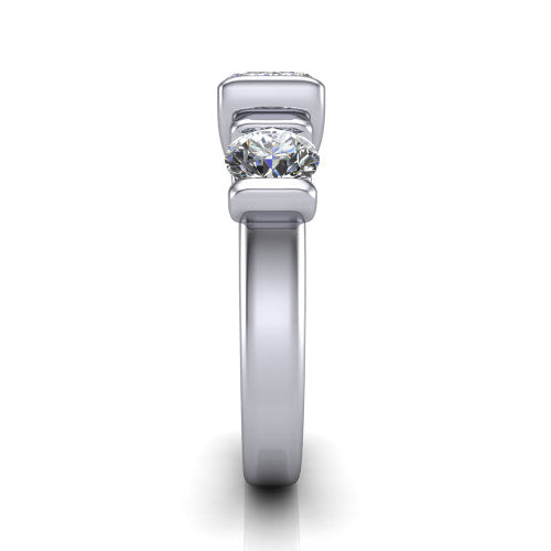 Elianna emerald three stone engagement ring in 18K White Gold, side profile showing the plain polished band and the bar-set side stones in profile