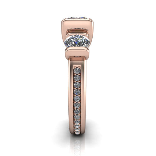 Fatima princess three stone engagement ring in 14K Rose Gold, side profile showing the pavé running down the band and the bar-set side stones in profile