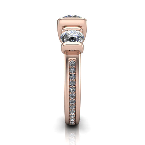 Fatima round three stone engagement ring in 18K Rose Gold, side profile showing the pavé running down the band and the bar-set side stones in profile