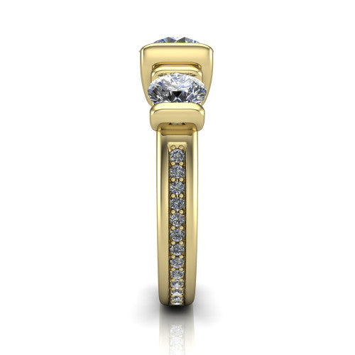 Fatima round three stone engagement ring in 18K Yellow Gold, side profile showing the pavé running down the band and the bar-set side stones in profile