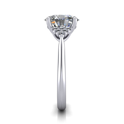 Raya oval three stone engagement ring in Platinum, side profile showing the slim milgrain cathedral band and the side clusters in profile