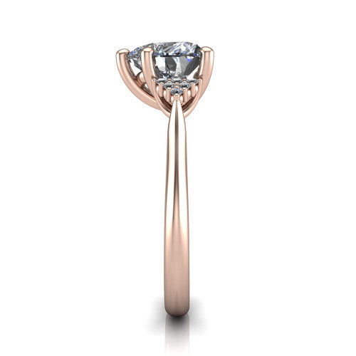 Raya heart three stone engagement ring in 14K Rose Gold, side profile showing the slim milgrain cathedral band and the side clusters in profile