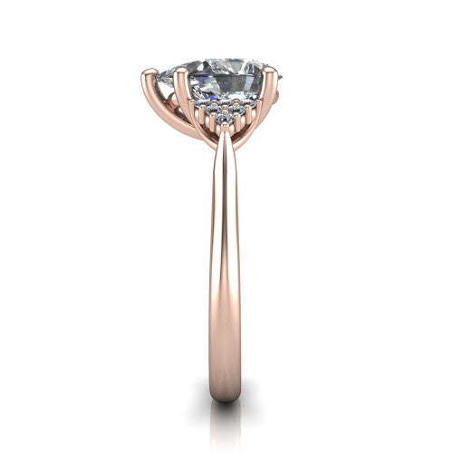 Raya pear three stone engagement ring in 14K Rose Gold, side profile showing the slim milgrain cathedral band and the side clusters in profile