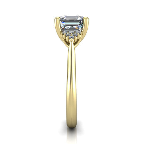 Raya square emerald three stone engagement ring in 14K Yellow Gold, side profile showing the slim milgrain cathedral band and the side clusters in profile