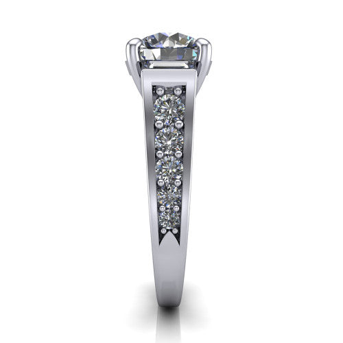 Estella round three stone engagement ring in Platinum, side profile showing the tapered baguette side stone and the round diamonds running down the shank