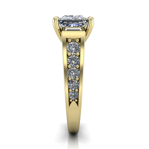 Estella princess three stone engagement ring in 14K Yellow Gold, side profile showing the tapered baguette side stone and the round diamonds running down the shank