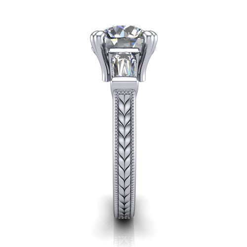 Camille round three stone engagement ring in 14K White Gold, side profile showing the tapered baguette side stone and the hand-engraved wheat pattern down the band