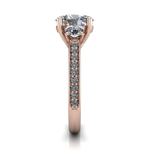 London oval classic engagement ring in 14K Rose Gold, side profile showing the round side stone and the pavé diamonds running down the shank