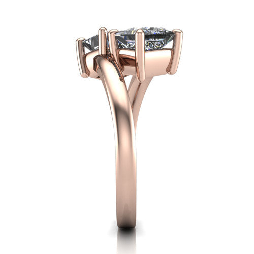 Adelaide princess three stone engagement ring in 18K Rose Gold, side profile showing the slim single bypass band swirling beneath the two-stone head