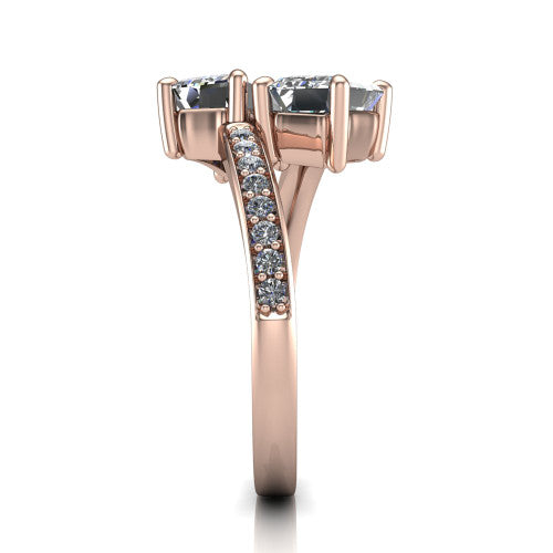 Payton emerald three stone engagement ring in 18K Rose Gold, side profile showing the pavé split shank crossing in a bypass beneath the two-stone head