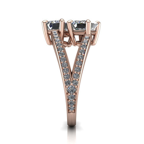 Malani emerald three stone engagement ring in 14K Rose Gold, side profile showing the split shank dividing into two pavé rows beneath the two-stone head