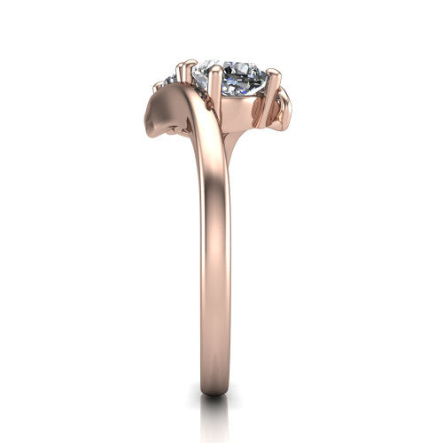Alayna cushion three stone engagement ring in 14K Rose Gold, side profile showing the bypass swirl shoulders crossing beneath the two-stone head